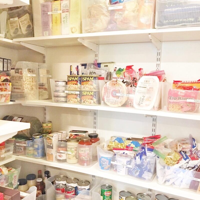 professionally organized kitchen pantry with food storage labeled containers