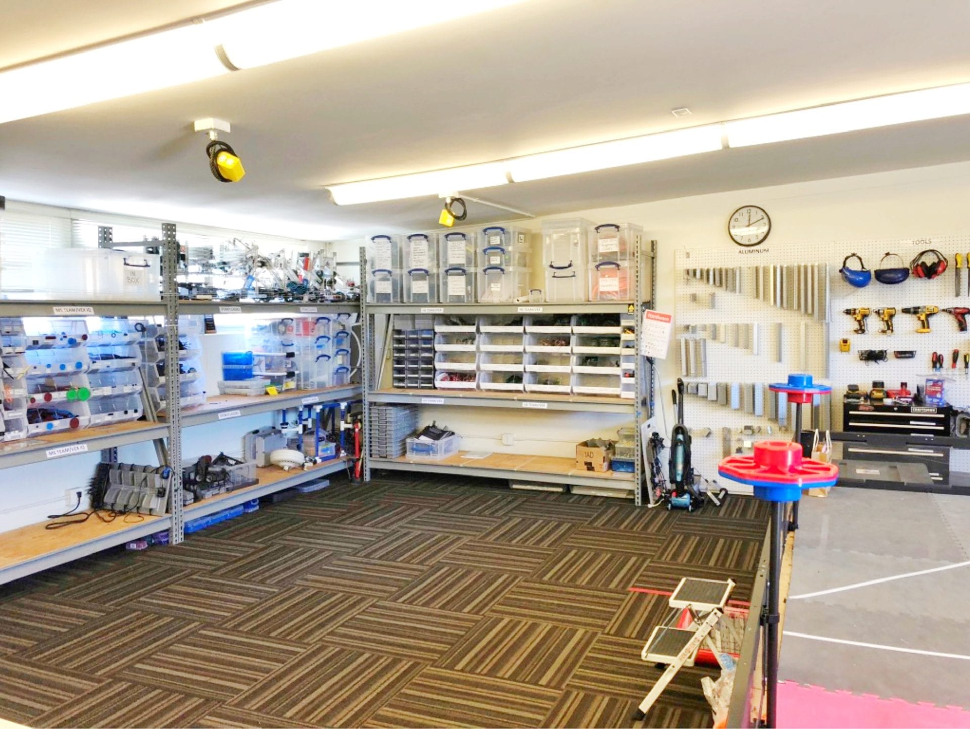 organized garage space with large storage shelves professional organizer help
