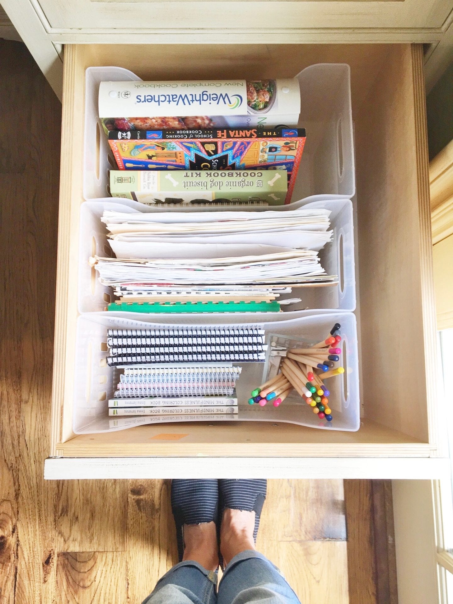 organized kitchen drawer with cookbooks mail notepads colored pencils in filing system