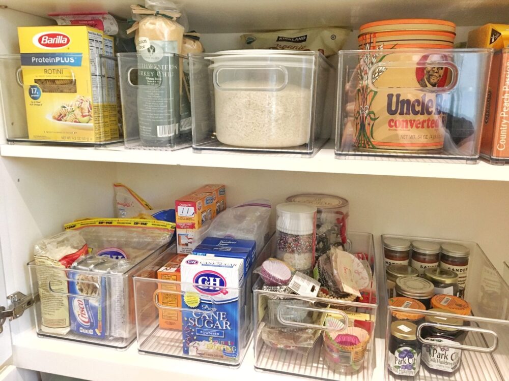 organized kitchen pantry with food storage containers and tidy shelving