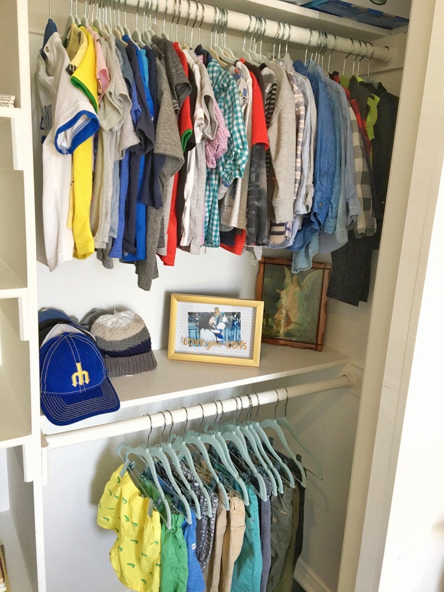 professional organized kids closet little boys closet with clothes hanging neatly