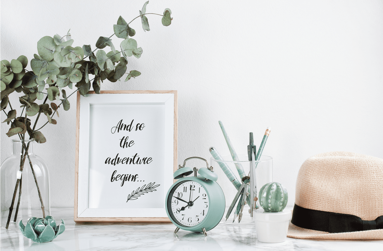 and so the adventure begins signage with mint green table clock summer hat eucalyptus plant in clean white home decor