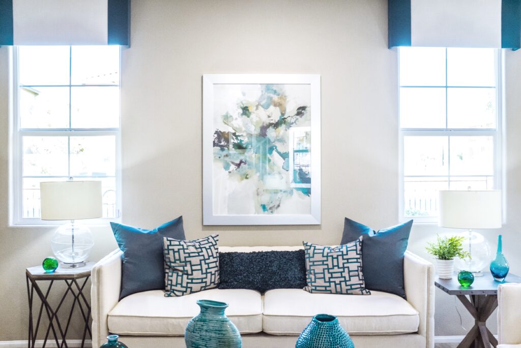 blue and white themed living room tidy and clean with bright lighting