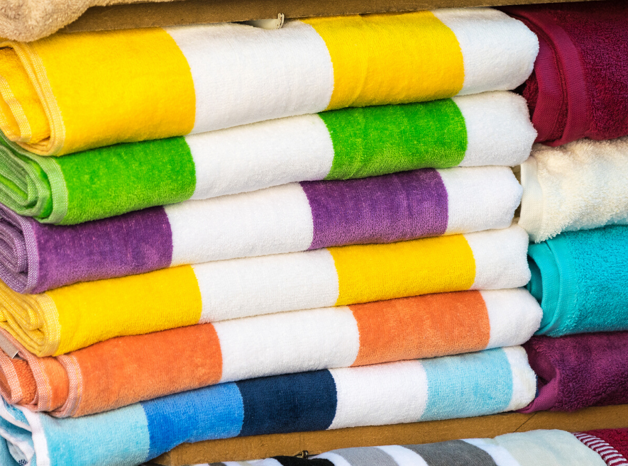 pile of clean beach towels folded neatly for summer fun