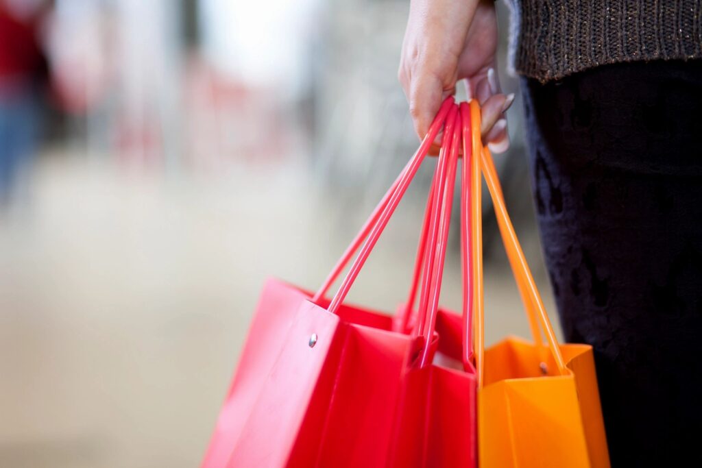 Woman holding reusable shopping bags