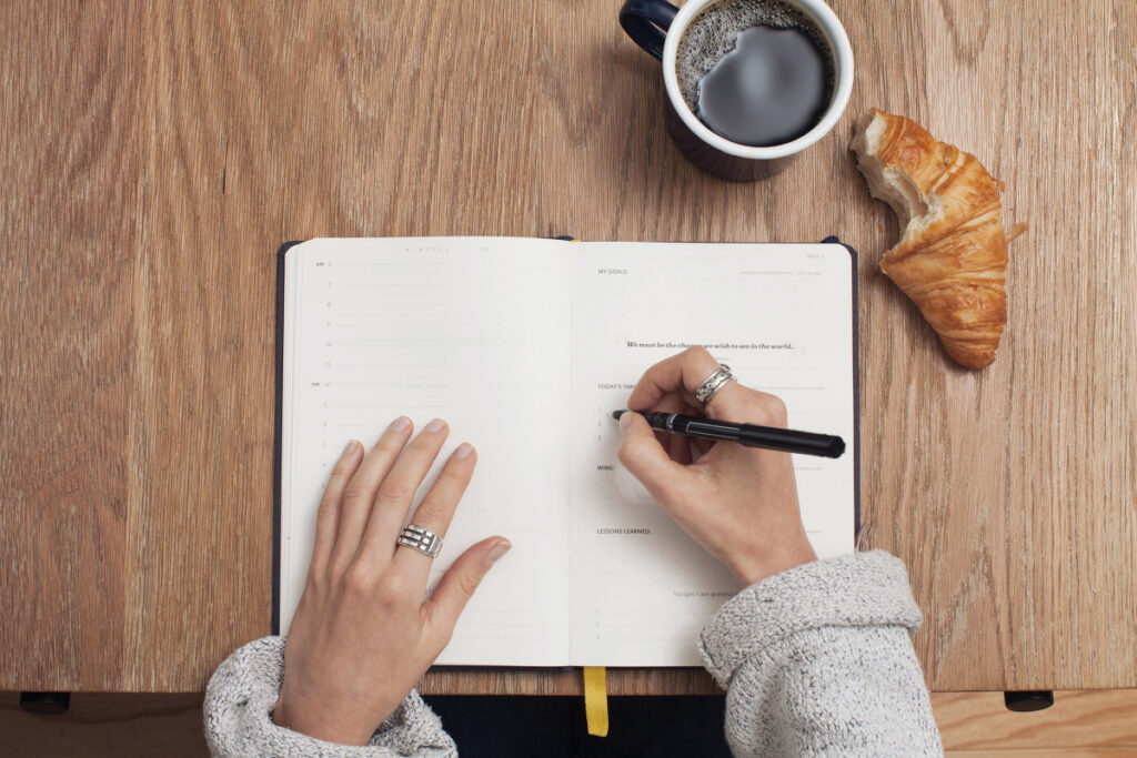 image of woman journaling for self-care